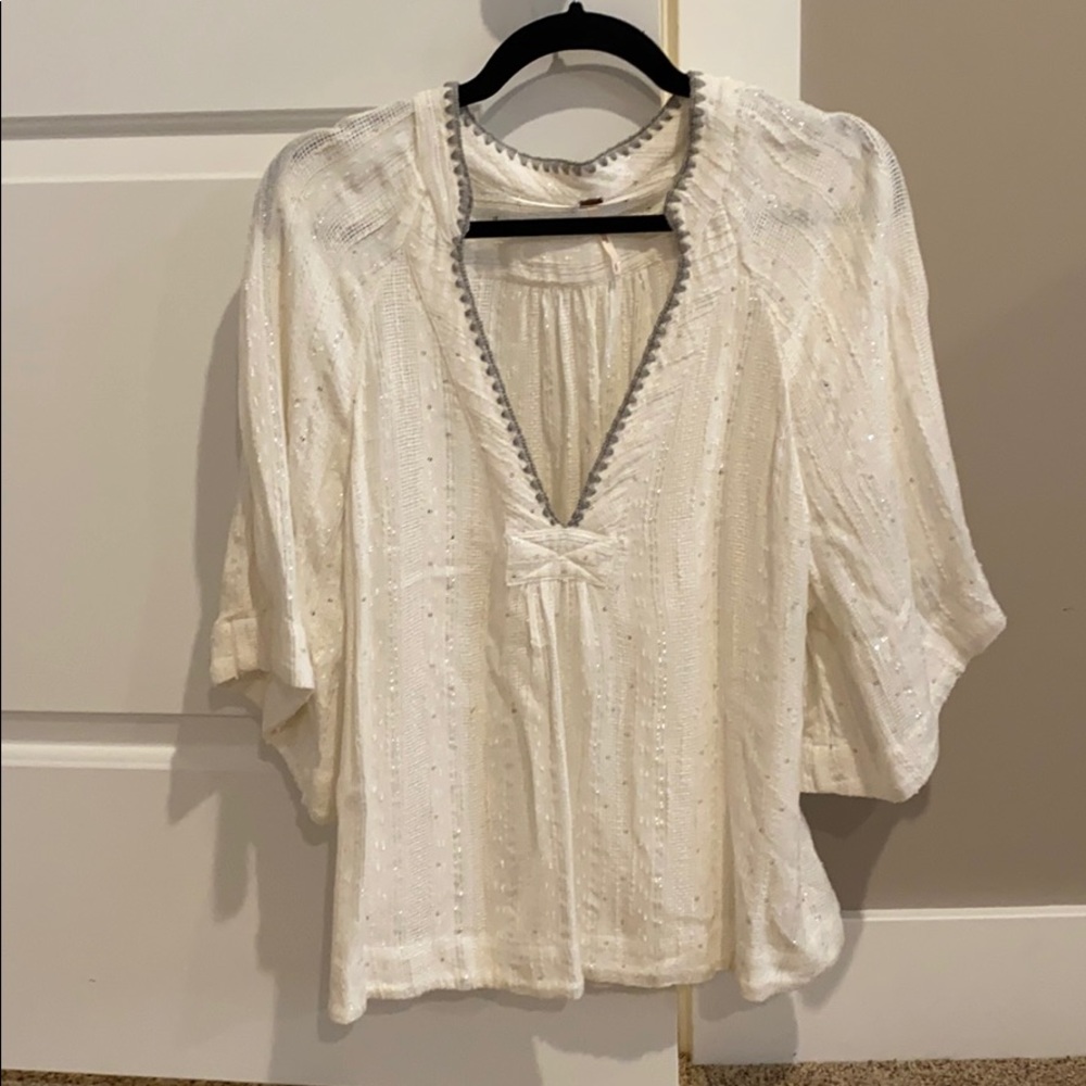 White flounce sleeve top